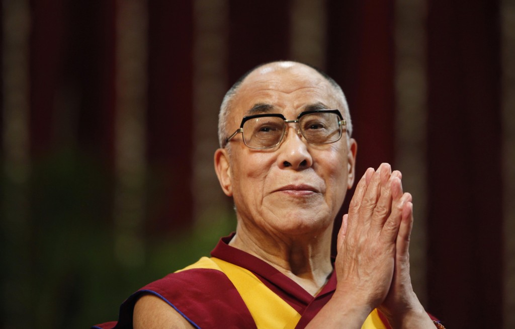 The Dalai Lama gestures before speaking to students during a talk at Mumbai University February 18, 2011. REUTERS/Danish Siddiqui (INDIA - Tags: EDUCATION RELIGION) - RTR2IRAI